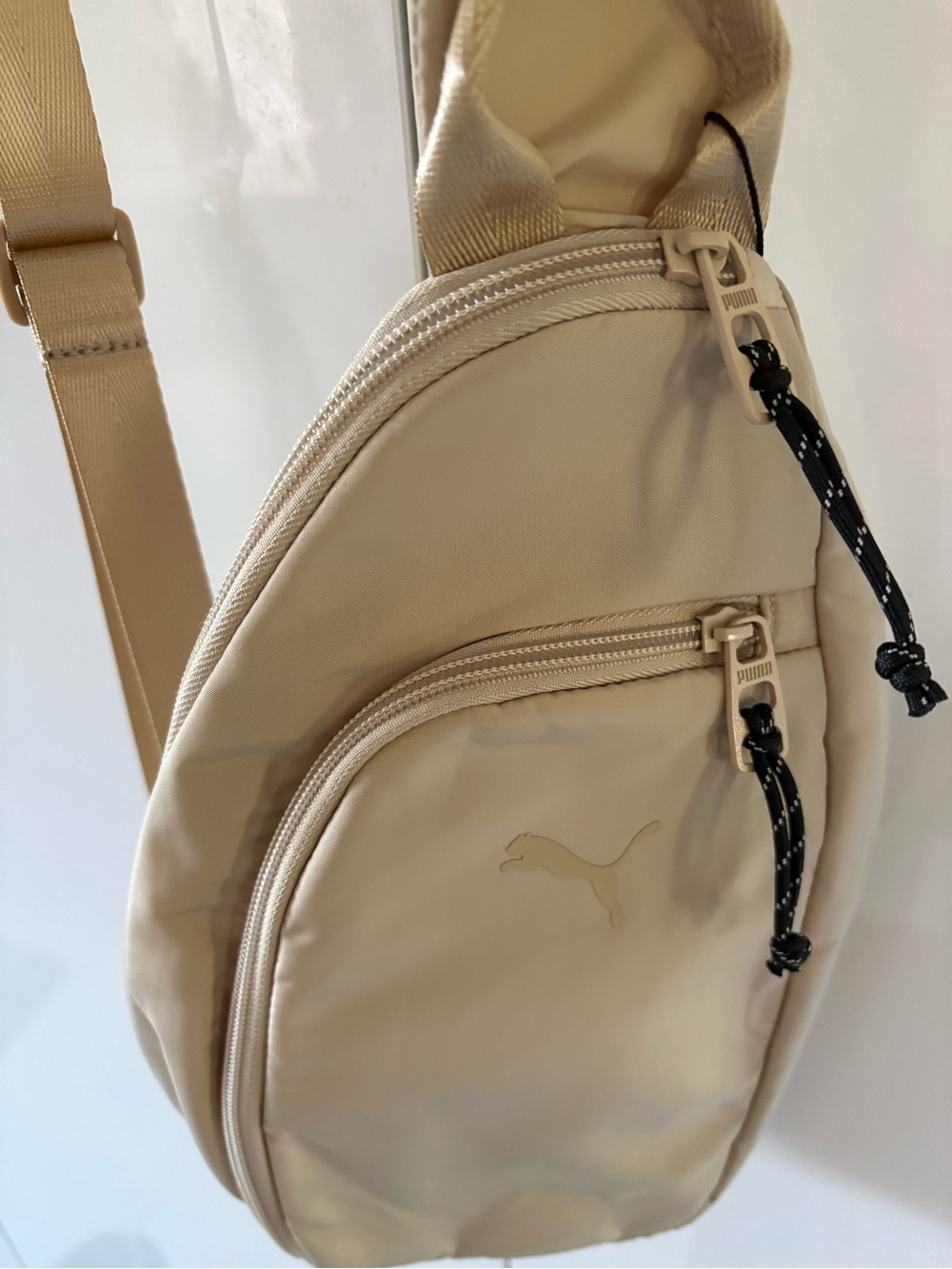 Puma Light beige Sling Belt Bag with Black Cord Pulls